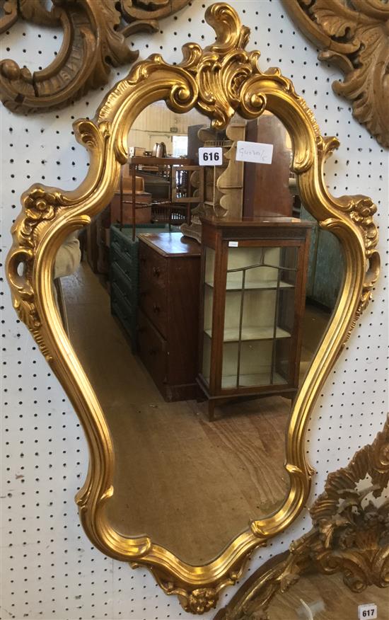 Shaped gilt mirror